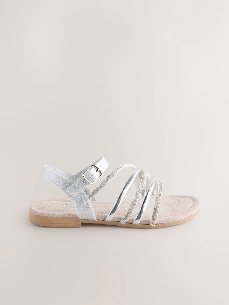 Sandales plates argentées croisées pour femme – Élégantes et confortables pour l’été au Maroc