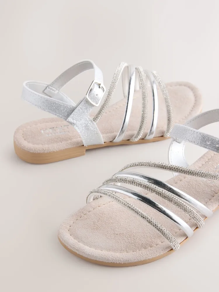 Sandales plates argentées croisées pour femme – Élégantes et confortables pour l’été au Maroc